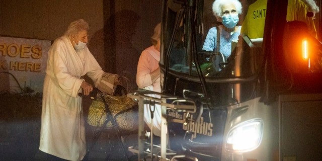Residents of the Oakmont Gardens senior home evacuate by bus as the Shady Fire approaches Santa Rosa Calif., Monday, Sept. 28, 2020.