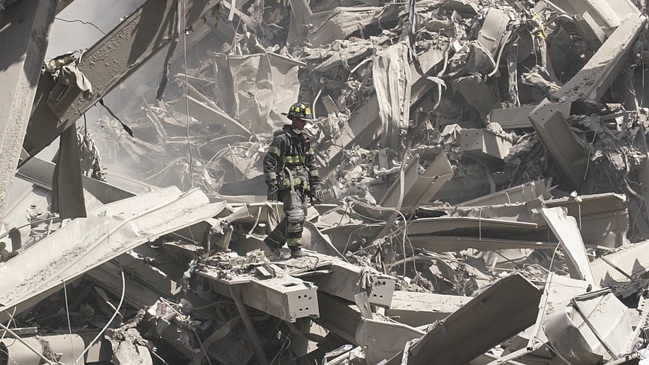 Firefighters search for survivors after the collapse of the World Trade Center on 9/11