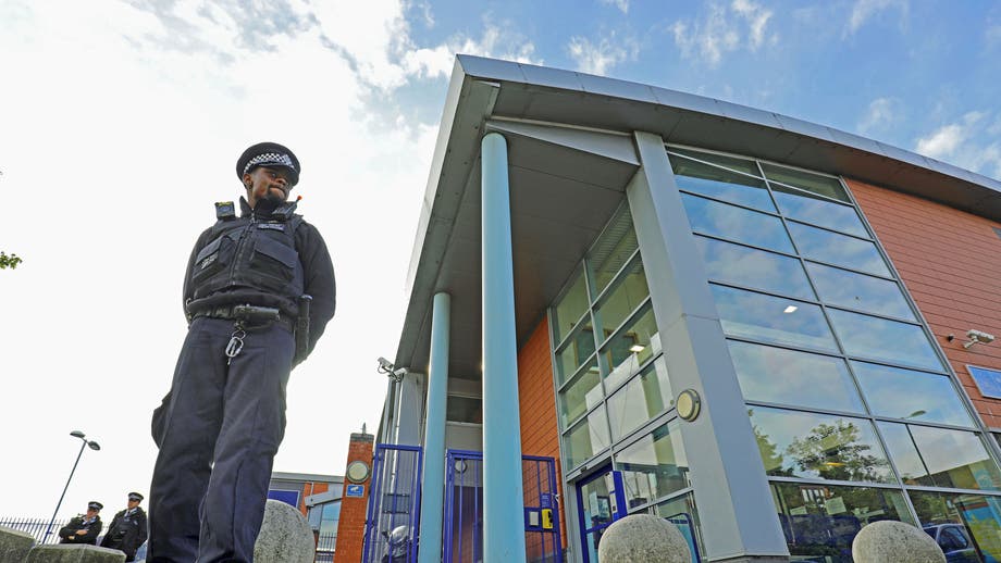 London officer shot dead while detaining suspect at station