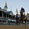 Jockey John Velazquez riding Authentic crosses the finish line to win the 146th running of the Kentucky Derby at Churchill Downs, in Louisville, Kentucky, Sept. 5, 2020.