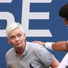 Before being disqualified, Novak Djokovic of Serbia tends to a line judge, Laura Clark, whom he hit with a ball during his fourth-round match at the 2020 US Open tennis championships in New York City, Sept 6, 2020. 