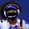 Naomi Osaka, of Japan, wears a protective mask featuring the name "George Floyd," while arriving on the court to face Shelby Rogers, of the United States, during the quarterfinal round of the US Open tennis championships, in New York City, Sept. 8, 2020.