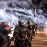 Police use chemical irritants and crowd control munitions to disperse protesters during the 100th consecutive day of demonstrations in Portland, Sept. 5, 2020.