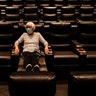 Karen Speros waits for a movie to start at a Regal movie theater in Irvine, California, Sept. 8, 2020. 