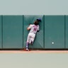 New York Mets center fielder Jake Marisnick hits the center-field wall while chasing a triple by Baltimore Orioles' Pedro Severino during their baseball game, in Baltimore, Sept. 2, 2020. 