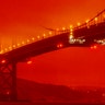 The Golden Gate Bridge is seen at 11 a.m. amid a smoky, orange hue caused by the area's ongoing wildfires in San Francisco, Sept. 9, 2020. 