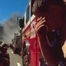 A New York firefighter amid the rubble of the World Trade Center following the 9/11 attacks. 