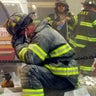 A firefighter breaks down after the World Trade Center buildings collapsed Sept. 11, 2001 after two hijacked airplanes slammed into the twin towers in a terrorist attack.