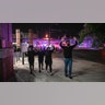 Protesters in Louisville, Ky., on Sept. 23, 2020, walk away from police with their hands up after two police officers were shot during a protest after a grand jury considering the March killing of Breonna Taylor, a Black medical worker, in her home in Louisville, voted to indict one of three White police officers for wanton endangerment.