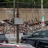 President Trump's motorcade passes a burnt building during his visit to Kenosha, Wis. 