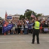 Supporters and protesters greet President Trump.