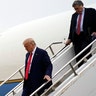 President Trump arrives on Air Force One, followed by Attorney General William Barr, at Waukegan National Airport in Waukegan, Ill.