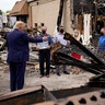 President Trump talks to business owners Tuesday, as he tours an area damaged during demonstrations after a police officer shot Jacob Blake in Kenosha, Wis. 