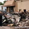 President Trump tours an area damaged during demonstrations after a police officer shot Jacob Blake in Kenosha, Wis., last week. At left, is Attorney General William Barr and acting Homeland Security Secretary Chad Wolf. 