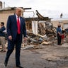 President Donald Trump tours an area Tuesday, Sept. 1, 2020, that was damaged during demonstrations after a police officer shot Jacob Blake in Kenosha, Wis. (AP Photo/Evan Vucci)