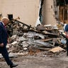 President Donald Trump walks over to talk to business owners Tuesday, Sept. 1, 2020, as he tours an area damaged during demonstrations after a police officer shot Jacob Blake in Kenosha, Wis. (AP Photo/Evan Vucci)