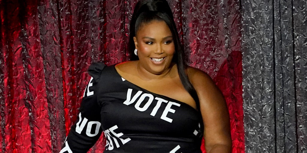 Lizzo bares all in American flag outfit as she encourages voters to ‘stay  in line’ at polls on Election Day