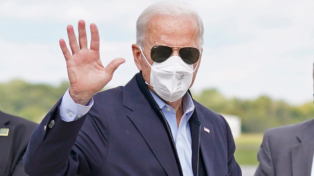 Biden lowers mask to cough into hand in viral video