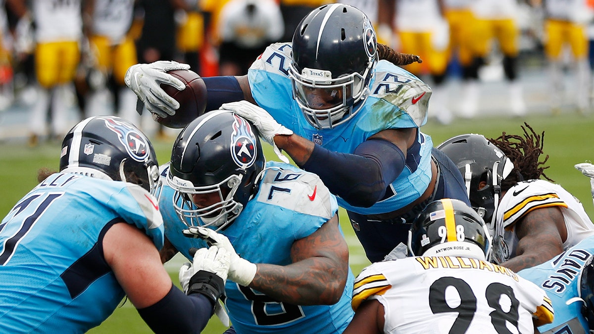 Tennessee Titans running back Derrick Henry (22) follows the blocking of offensive guard Rodger Saffold (76) as Henry scores a touchdown against the Pittsburgh Steelers in the second half of an NFL football game Sunday, Oct. 25, 2020, in Nashville, Tenn. (AP Photo/Wade Payne)