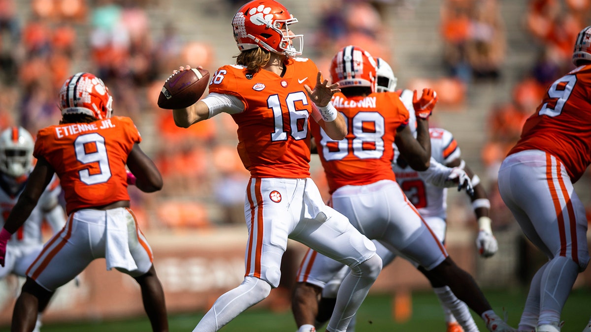 Clemson quarterback Trevor Lawrence (16) throws a pass during an NCAA college football game against Syracuse in Clemson, S.C., on Saturday, Oct. 24, 2020. (Ken Ruinard/Pool Photo via AP)