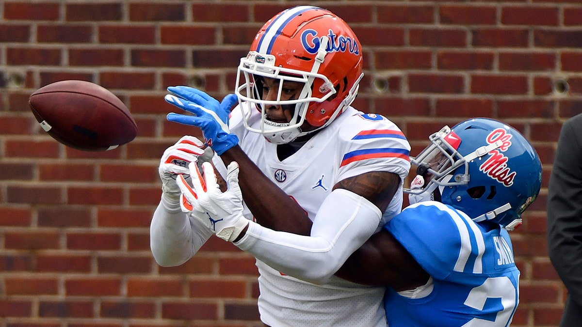 Mississippi defensive back A.J. Finley (21) breaks up a pass intended for Florida wide receiver Trevon Grimes (8) during the first half of an NCAA college football game in Oxford, Miss., Saturday, Sept. 26, 2020. (AP Photo/Thomas Graning)