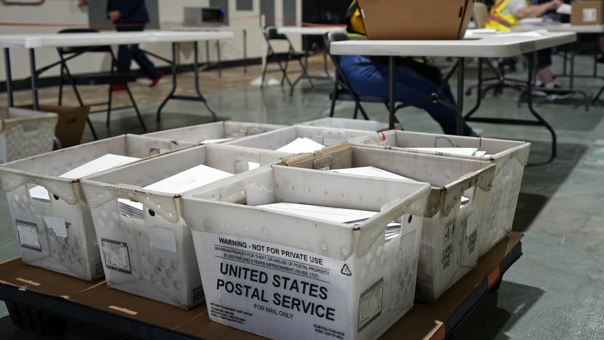 FILE - In this Sept. 3, 2020, file photo, workers prepare absentee ballots for mailing at the Wake County Board of Elections in Raleigh, N.C. (AP Photo/Gerry Broome)