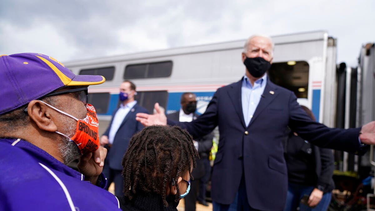 Supporters greet Democratic presidential candidate former Vice President Joe Biden as he steps of the train at Amtrak's Alliance Train Station, Wednesday, Sept. 30, 2020, in Alliance, Ohio. Biden is on a train tour through Ohio and Pennsylvania today. (AP Photo/Andrew Harnik)