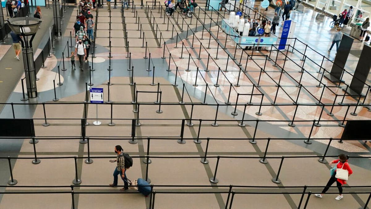 The number of travelers passing through TSA checkpoints dropped to fewer than 100,000 on several days earlier this year. (AP Photo/David Zalubowski)