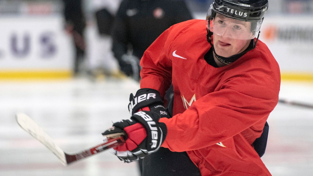 In this Jan. 1, 2020, file photo, Canada's Alexis Lafreniere shoots during the team's practice at the World Junior Hockey Championships in Ostrava, Czech Republic. (Ryan Remiorz/The Canadian Press via AP, File)