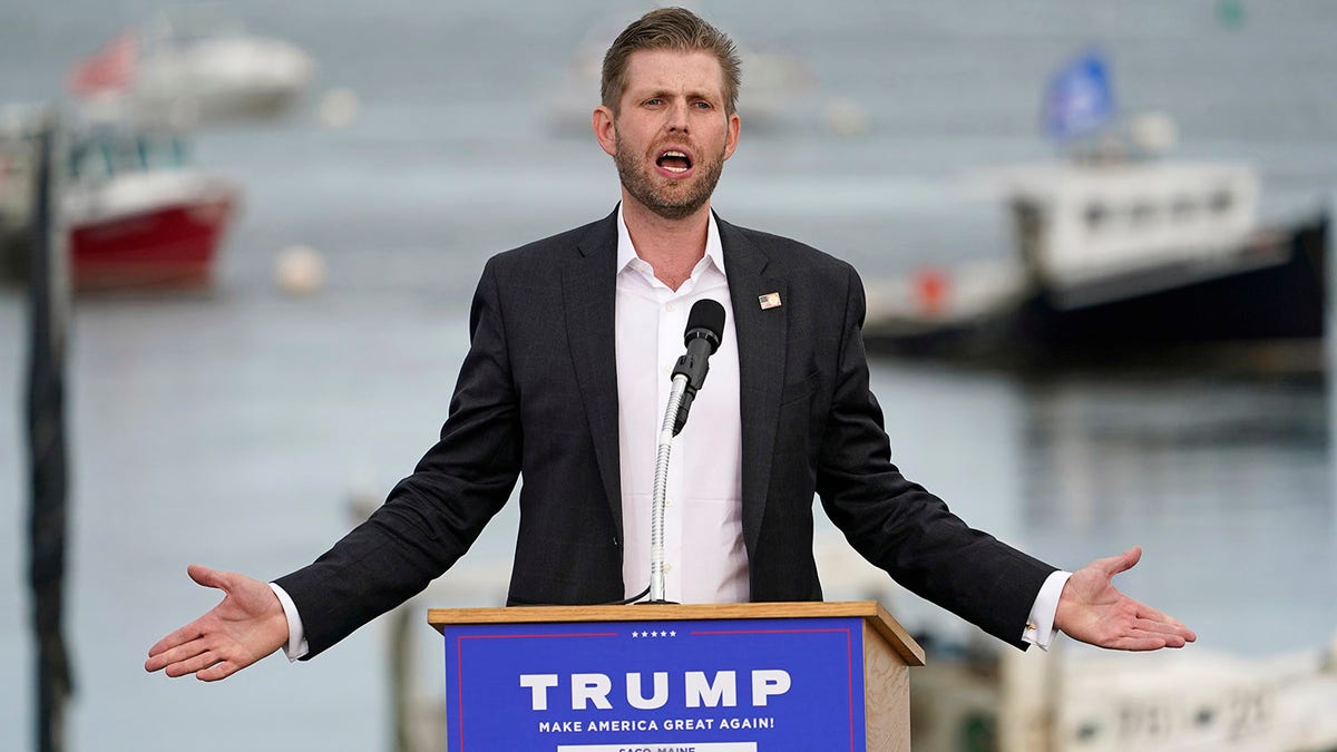 Eric Trump, son of former President Donald Trump speaking while wearing a suit