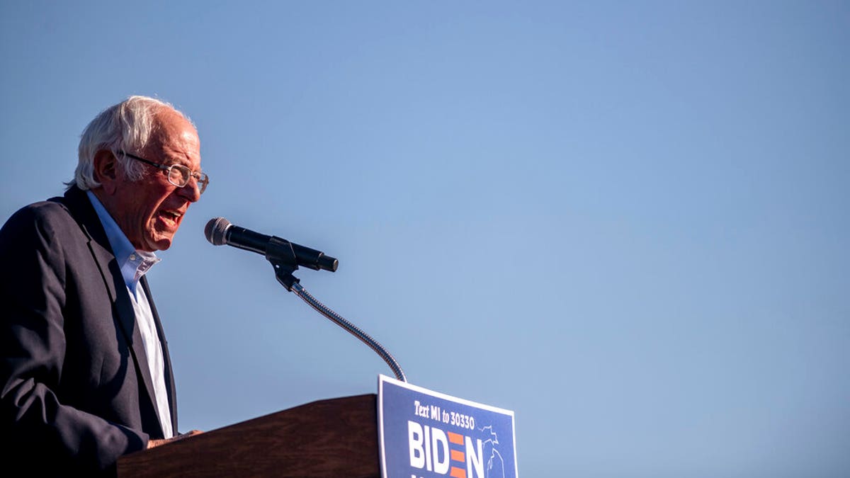 Sen. Bernie Sanders speaks to the crowd at a car rally campaign event for Democratic presidential candidate former Vice President Joe Biden on Monday, Oct. 5, 2020, in Warren, Mich. 
