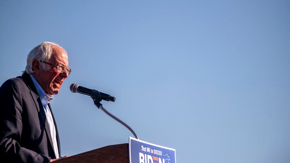 Sen. Bernie Sanders speaks to the crowd at a car rally campaign event for Democratic presidential candidate former Vice President Joe Biden on Monday, Oct. 5, 2020, in Warren, Mich.