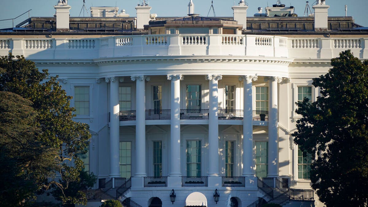 The White House is seen in Washington, early Tuesday, Oct. 6, 2020, the morning after President Donald Trump returned from the hospital where he was treated for COVID-19. 