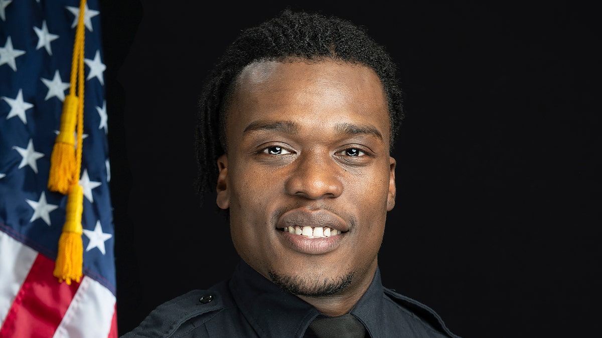 This undated photo provided by the Wauwatosa Police Department in Wauwatosa, Wis., shows Wauwatosa Police Officer Joseph Mensah. In a report released Wednesday Oct. 7, 2020, an independent investigator recommended officials in the Milwaukee suburb fire Mensah, who has shot and killed three people in the last five years. (Gary Monreal/Monreal Photography LLC/Wauwatosa Police Department via AP)