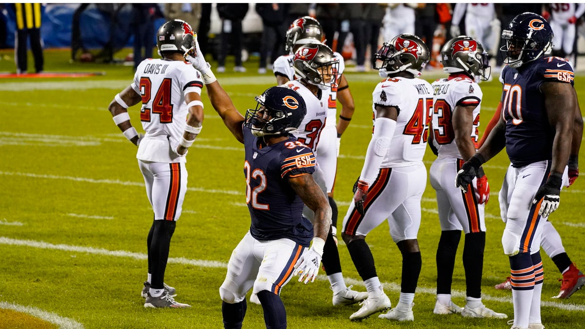 Chicago Bears running back David Montgomery (32) celebrates a touchdown against the Tampa Bay Buccaneers during the first half of an NFL football game in Chicago, Thursday, Oct. 8, 2020. (AP Photo/Nam Y. Huh)