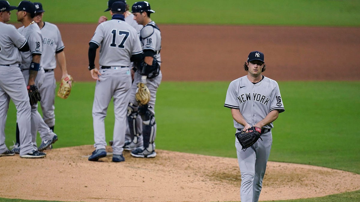 New York Yankees' Gerrit Cole walks to the dugout after being removed during the sixth inning in Game 5 of the baseball team's AL Division Series against the Tampa Bay Rays, Friday, Oct. 9, 2020, in San Diego. (Associated Press)