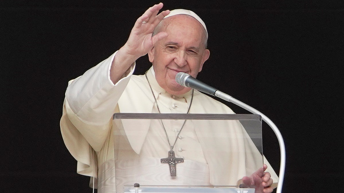 FILE -- In this Sept. 20, 2020 file photo, Pope Francis delivers his blessing as he recites the Angelus noon prayer from the window of his studio overlooking St.Peter's Square, at the Vatican. The pontiff on Saturday, Oct. 10 recorded a video message to a TED conference on climate change, that will be released later Saturday night. (AP Photo/Andrew Medichini)