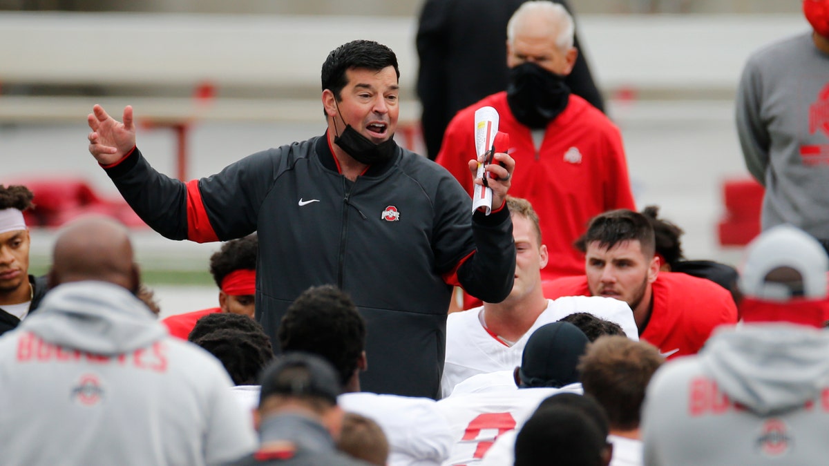FILE - In this Oct. 3, 2020, file photo, Ohio State head coach Ryan Day talks to his team during their NCAA college football practice in Columbus, Ohio. No. 6 Ohio State has outsized expectations for the 2020 season after coming within one play of advancing to the national championship game last season. (AP Photo/Jay LaPrete, File)