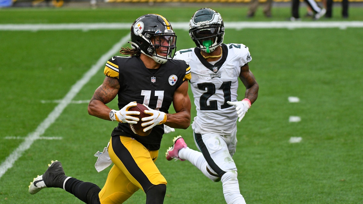 Pittsburgh Steelers wide receiver Chase Claypool (11) beats Philadelphia Eagles strong safety Jalen Mills (21) to the end zone for a touchdown during the first half of an NFL football game in Pittsburgh, Sunday, Oct. 11, 2020. (AP Photo/Don Wright)