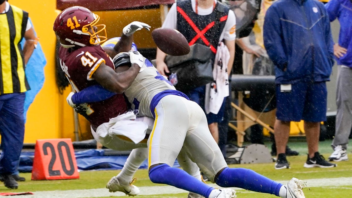 Los Angeles Rams' Jordan Fuller breaks up a pass intended for Washington Football Team's J.D. McKissic during the second half of an NFL football game Sunday, Oct. 11, 2020, in Landover, Md. (AP Photo/Steve Helber)