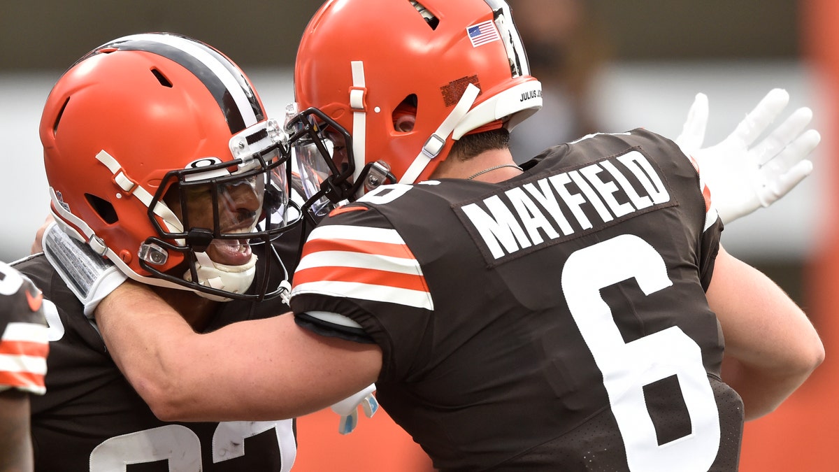 Cleveland Browns wide receiver Rashard Higgins (82) and quarterback Baker Mayfield celebrate after a 15-yard touchdown by Higgins during the first half of an NFL football game against the Indianapolis Colts, Sunday, Oct. 11, 2020, in Cleveland. (AP Photo/David Richard)