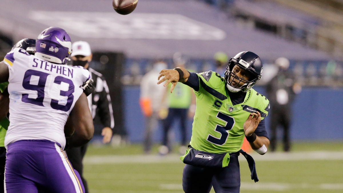 Seattle Seahawks quarterback Russell Wilson throws against the Minnesota Vikings during the second half of an NFL football game, Sunday, Oct. 11, 2020, in Seattle. (AP Photo/John Froschauer)