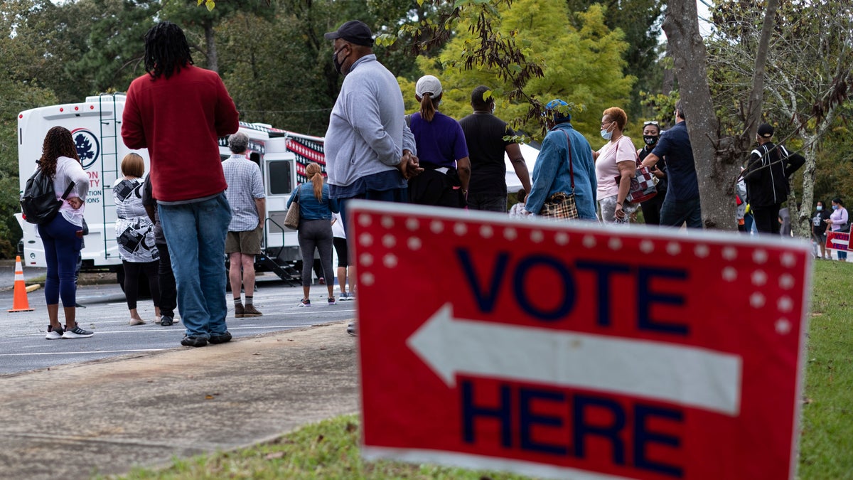 Voters line up for early voting at a Fulton County mobile voting station on Oct. 12, 2020 at St. Paul's Episcopal Church in Southwest Atlanta.  (Ben Gray/Atlanta Journal-Constitution via AP)