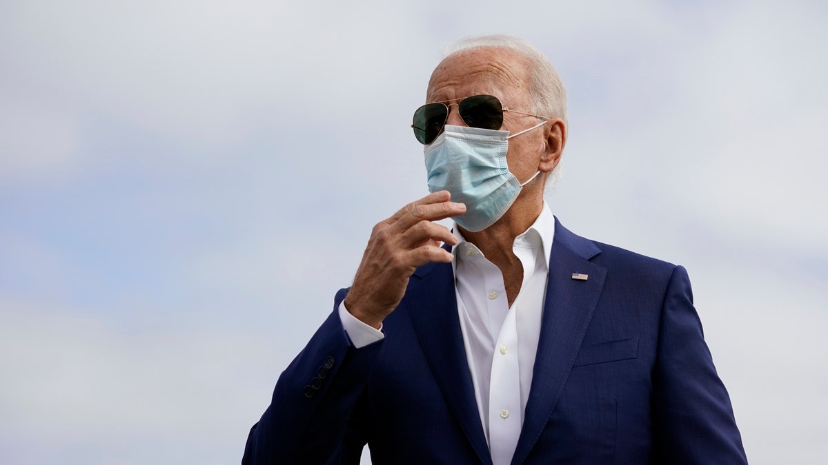 Democratic presidential candidate former Vice President Joe Biden speaks to members of the media before boardin his campaign plane at New Castle Airport, in New Castle, Del., Tuesday Oct. 13, 2020, en route to Florida. (AP Photo/Carolyn Kaster)