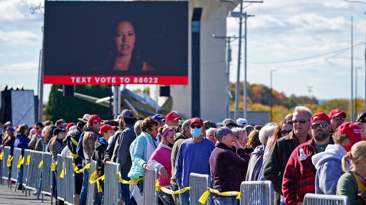 Supporters of President Donald Trump wait to enter a campaign rally Tuesday, Oct. 13, 2020, at John P. Murtha Johnstown-Cambria County Airport in Johnstown, Pa. (AP)