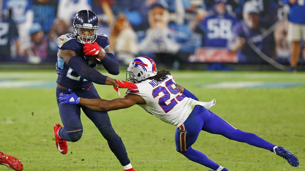 Tennessee Titans running back Derrick Henry gets past Buffalo Bills cornerback Josh Norman in the second half, Oct. 13, 2020, in Nashville, Tennessee. (AP Photo/Wade Payne)
