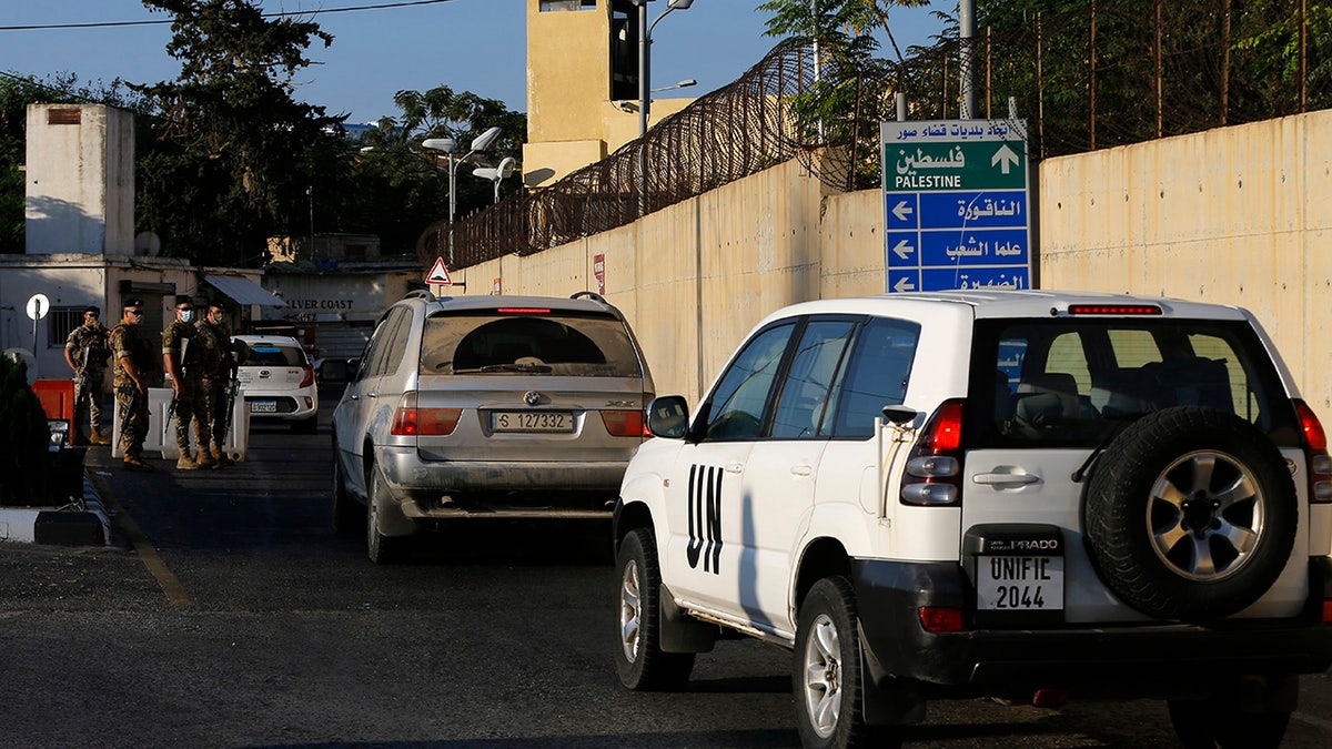 UNIFIL and civilian cars enter the headquarters of the U.N. peacekeeping force in the southern Lebanese border town of Naqoura, Lebanon, Wednesday, Oct. 14, 2020. (AP Photo/Bilal Hussein)