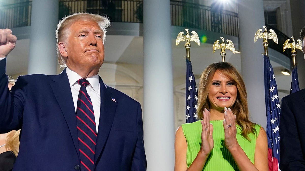 President Trump and first lady Melania Trump stand on the South Lawn of the White House, Aug. 27, 2020, in Washington. (Associated Press)