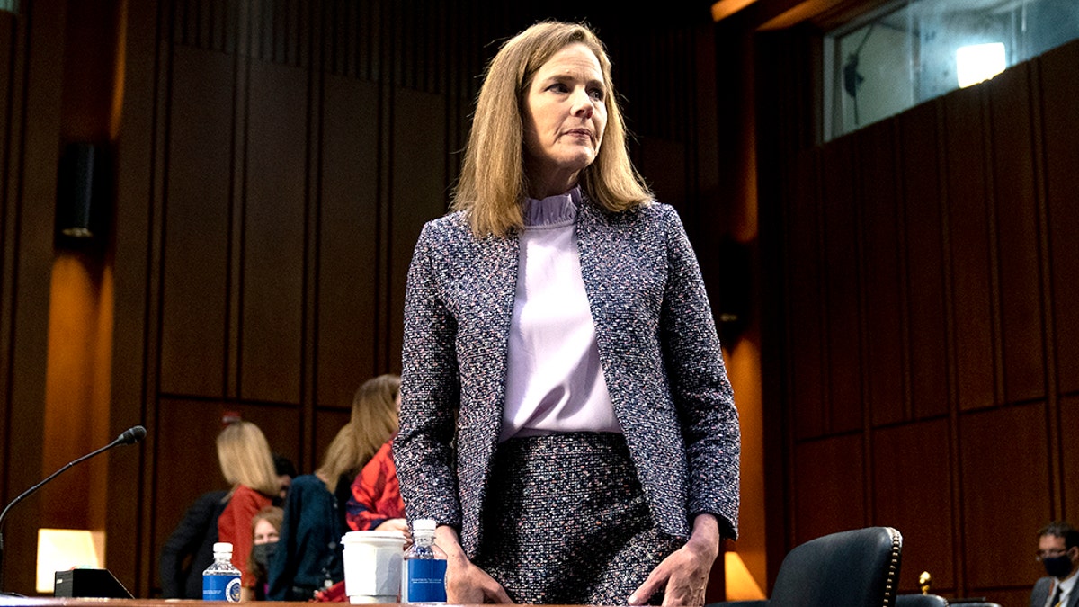 Supreme Court nominee Amy Coney Barrett departs during a break in a confirmation hearing before the Senate Judiciary Committee on Capitol Hill in Washington. (Stefani Reynolds/Pool via AP)