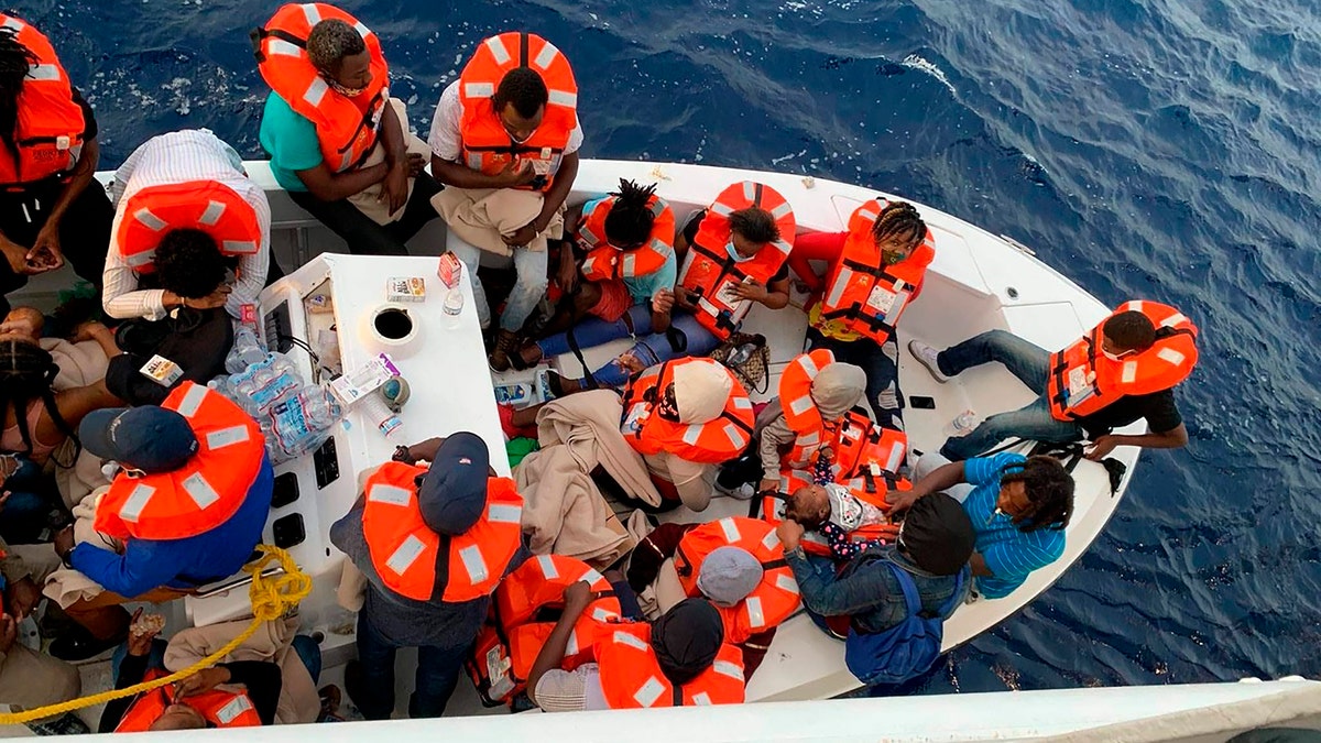 This photo provided by Carnival Cruise Line shows people after being rescued by a Carnival Cruise Line ship off the Florida coast, the cruise line reported Saturday, Oct. 17, 2020. (Carnival Cruise Line via AP)